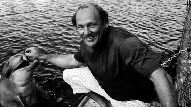 Sea World Director Keith Williams feeding a dolphin in 1972.