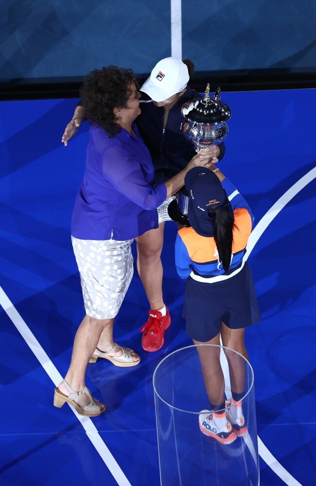The humble Aussie receiving the Daphne Akhurst trophy from her idol, close friend and 13-time tennis champion Evonne Goolagong Cawley. Picture: Mark Metcalfe/Getty Images