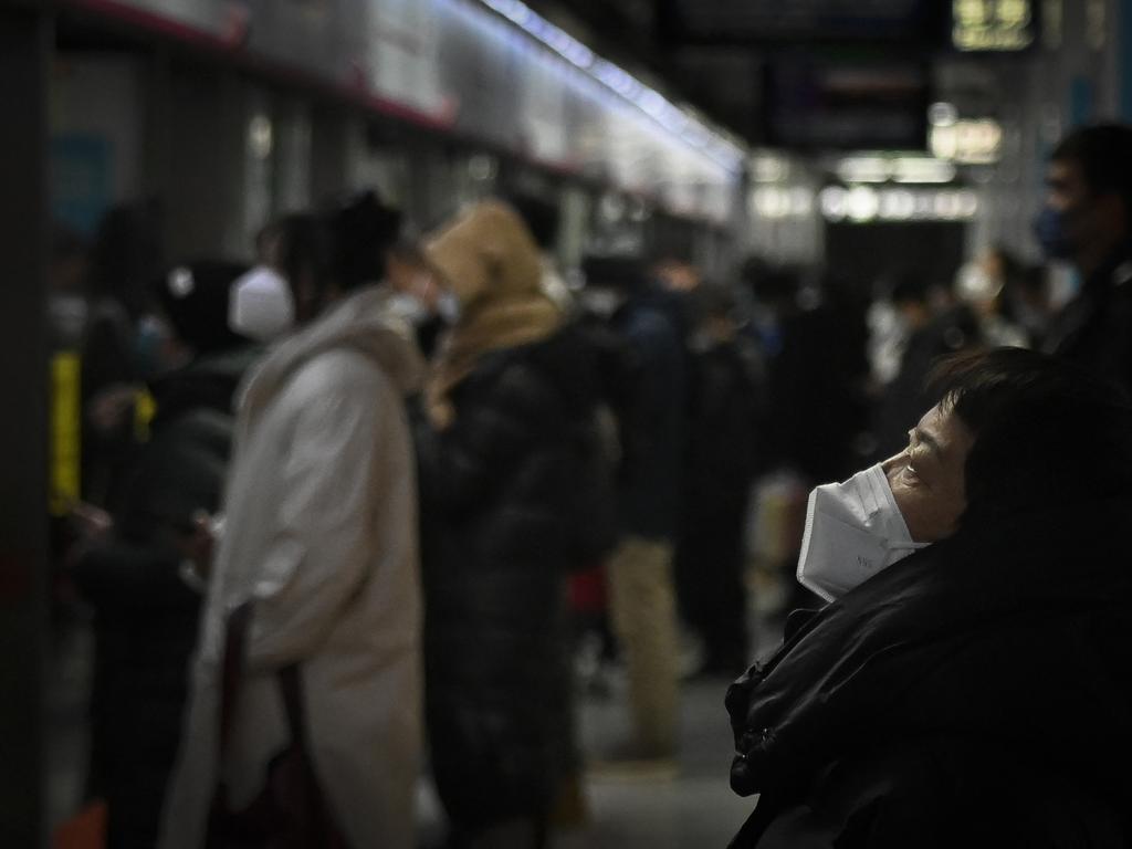 A woman waits for a train at a Beijing subway station. Picture: AFP