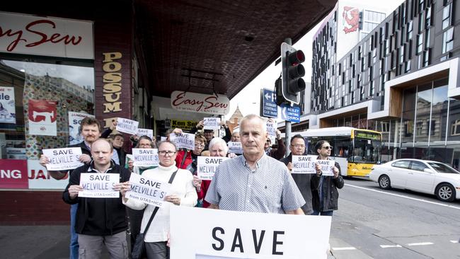 Denis McLoughlin and CBD traders, at Ezy Sew, cnr of Melville St and Elizabeth st. Shop owners are angry at UTAS plans for the street. Picture Eddie Safarik