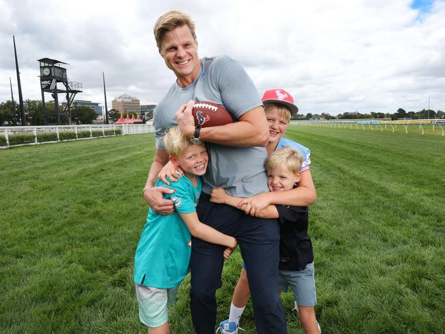 Riewoldt with sons, James, 10, Will, 8, and Teddy, 5, who played American football while the family lived in the US. Picture: David Caird