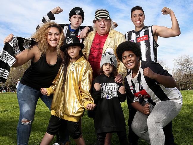 Collingwood FC 's Joffa Corfe is pictured with his daughter Ema Corfe ( scarf ) and grandkids Jeffrey Corfe Jnr 14yrs ( beanie ) , Simon Corfe 15yrs ( jumper ) , Laiema Bosenavulagi 13yrs ( front jumper ) , Destiny-Pearl Corfe 10yrs ( gold jacket ) and Tiana-Sita Corfe 4yrs. They are fired up for next weeks AFL Grand Final. Picture : Ian Currie