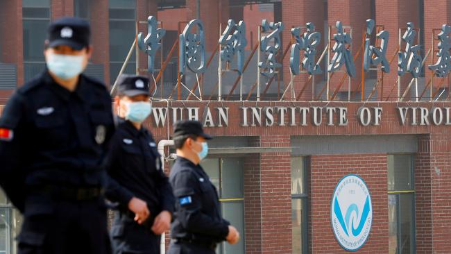 Security personnel keep watch outside the Wuhan Institute of Virology.