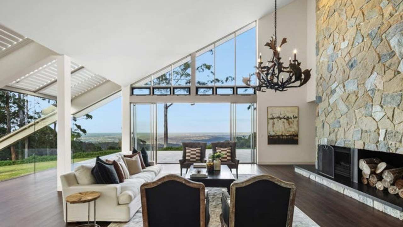 An elk antler chandelier enhances the US ski lodge-inspired style