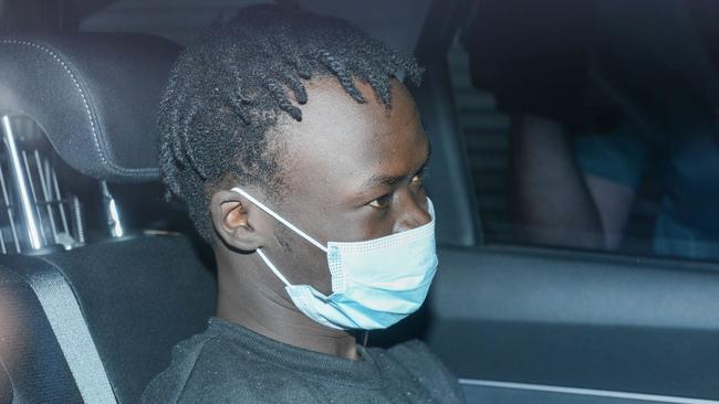 SA Police escort Mathiang Malok back to Adelaide from Melbourne to face charges including attempted murder. Picture: Brenton Edwards