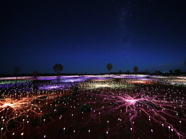 Field of Light is the latest addition to Ayers Rock Resort’s unique experiences, which also include Dinner Under the Stars. Picture: Mark Pickthall