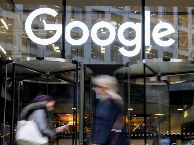 People walk past Google's UK headquarters in London on November 1, 2018. - Hundreds of employees walked out of Google's European headquarters in Dublin on Thursday as part of a global campaign over the US tech giant's handling of sexual harassment that saw similar protests in London and Singapore. (Photo by Tolga Akmen / various sources / AFP)