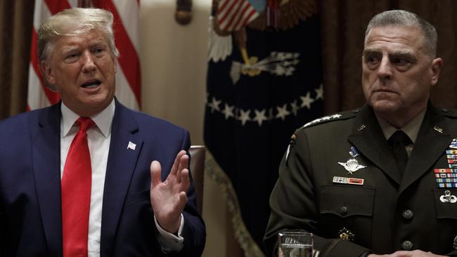 Donald Trump, joined by Chairman of the Joint Chiefs of Staff Gen. Mark Milley, defends his decision to withdraw troops. Picture: AP.