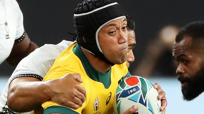 SAPPORO, JAPAN - SEPTEMBER 21: Christian Lealiifano of Australia is tackled by Samuel Matavesi of Fiji during the Rugby World Cup 2019 Group D game between Australia and Fiji at Sapporo Dome on September 21, 2019 in Sapporo, Hokkaido, Japan. (Photo by David Rogers/Getty Images)