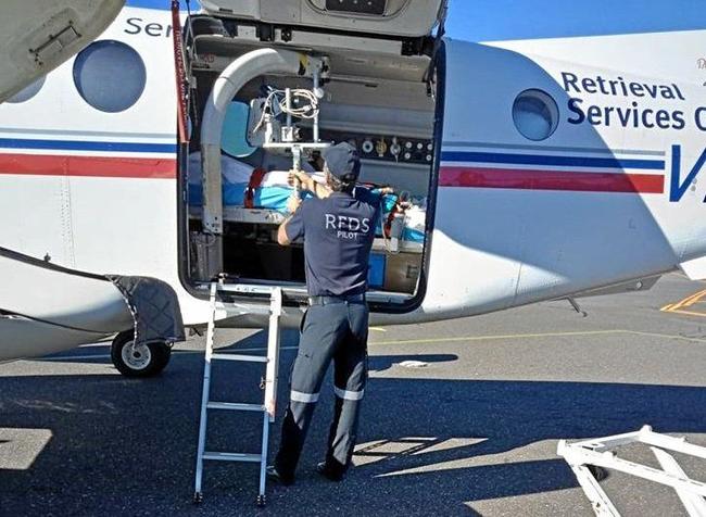 Christian Hermann is loaded on to the Royal Flying Doctor Service plane at the Rockhampton Airport. Picture: CONTRIBUTED