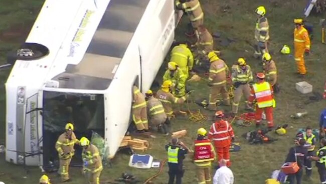 Emergency personnel respond to the crash and trapped children. Source: Nine News.