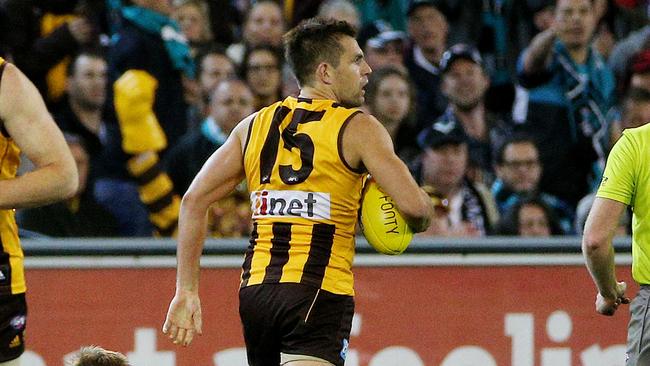 AFL 2nd Prelim Final, Hawthorn v Port Adelaide at MCG, Luke Hodge smothers a Brad Ebert kick late in the last quarter. 20th September 2014. Picture : Colleen Petch.