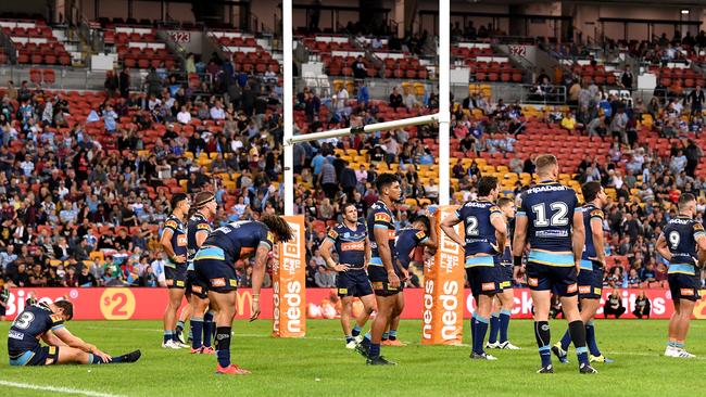 Titans players show their dejection after the loss to Cronulla. Picture: Getty Images