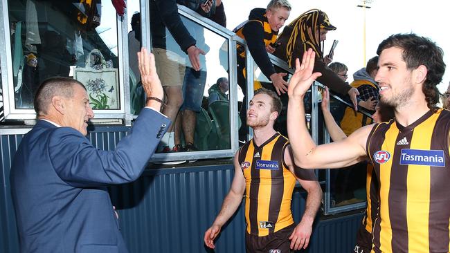 Jeff Kennett celebrates a Hawks win with his players in Launceston this year. Picture: Michael Dodge/Getty Images