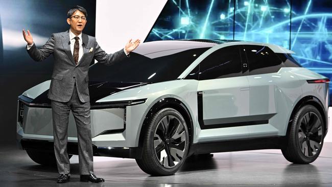 Toyota Motor President Koji Sato with the FT-3e SUV concept. Picture: Kazuhiro NOGI/AFP