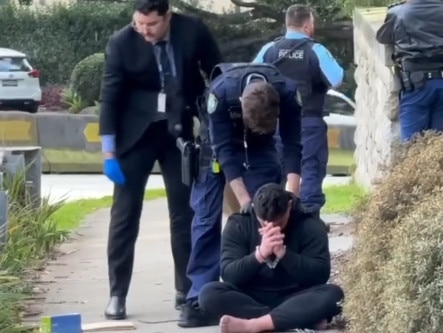 Screen shots from Channel Seven News of the 2 men in balaclavas who were arrested after being spotted in George Street in Dover Heights armed with a gun near the home of John Ibrahim. Picture: Channel 7