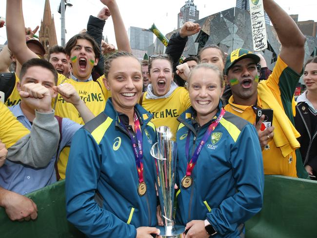 Champion Australian WomenÕs cricket squad celebrate in Melbourne at Federation Square, after securing the 2018 ICC T20 World Cup Trophy in the West Indies. Player of the Final Ashleigh Gardner and Player of the Series Alyssa Healy hold the trophy with excited fans at Fed Square.  Picture: David Caird