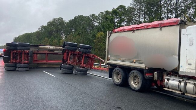 One lane is open after a truck’s trailer rolled onto its side on the Bruce Hwy in Nirimba. Picture: QAS