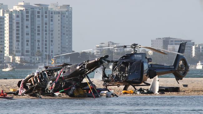 The devastating scene of a helicopter crash between two Seaworld Helicopters just outside the tourist park on a sandbank in the Southport Broadwater in January, 2023. Picture: Glenn Hampson