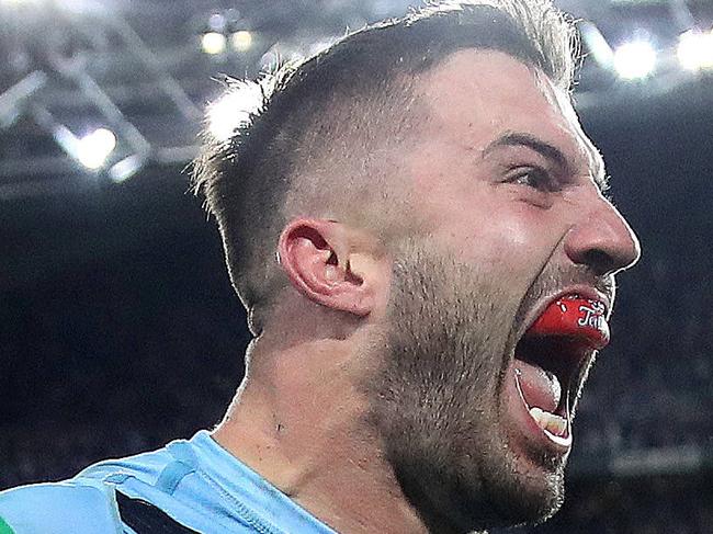 NSW's James Tedesco celebrates winning try with Mitchell Pearce during Game 3 of the State of Origin series between NSW Blues and Queensland at ANZ Stadium, July 10, 2019. Picture. Phil Hillyard