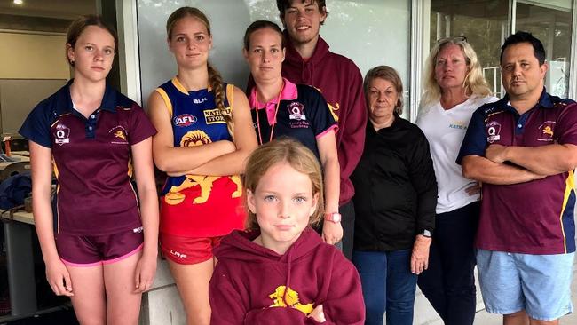 Katrina Beikoff (second from right), candidate in the Division 13 poll in the council election, with Palm Beach Currumbin Junior AFL members – they are concerned about increasing crime impacting on their club.