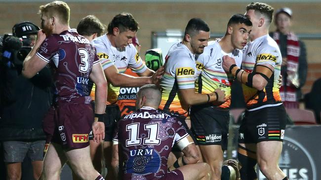 Charlie Staines congratulated by teammates after scoring a try against the Manly Sea Eagles at Lottoland in August.