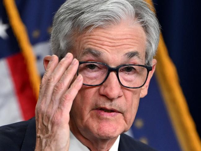 US Federal Reserve Chairman Jerome Powell gestures as he speaks at a press conference after the Monetary Policy Committee meeting in Washington, DC, on December 18, 2024. The US Federal Reserve cut interest rates by a quarter point December 18 and signaled a slower pace of cuts ahead, amid uncertainty about inflation and US President-elect Donald Trump's economic plans. Policymakers voted 11-to-1 to lower the central bank's key lending rate to between 4.25 percent and 4.50 percent, the Fed announced in a statement. They also penciled in just two quarter-point rate cuts for next year, and sharply hiked their inflation outlook for 2025. (Photo by ANDREW CABALLERO-REYNOLDS / AFP)