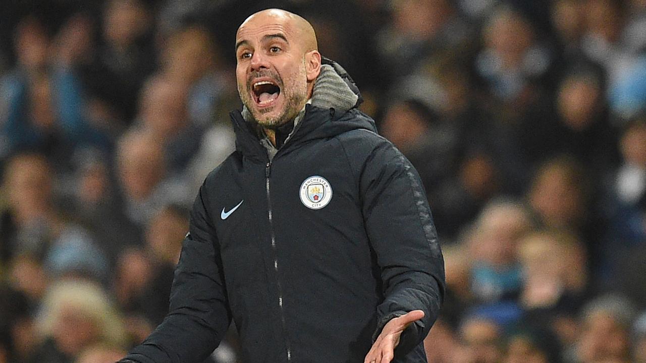 Manchester City's Spanish manager Pep Guardiola gestures on the touchline