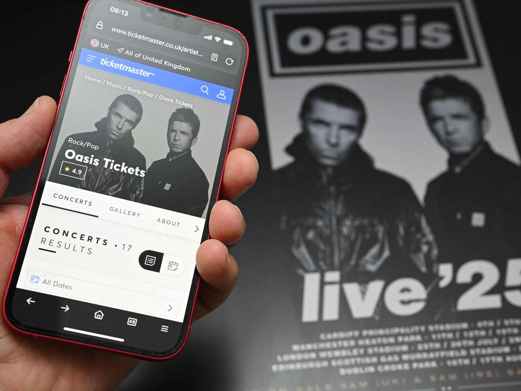 A fan uses a smart phone to access online ticket sales in the UK. Picture: Oli Scarff/AFP