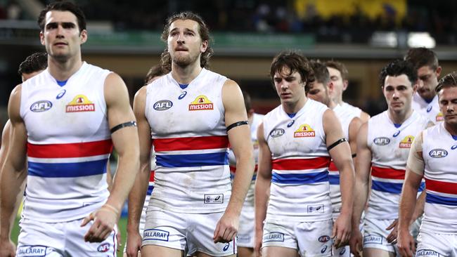 Easton Wood and Marcus Bontempelli lead the Bulldogs off Adelaide Oval.