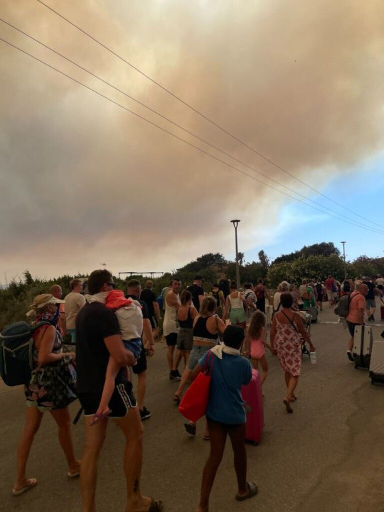 Island officials arranged for dozens of buses to take people to safety, but where fires had cut off road access, others had to walk. Picture: Twitter