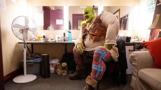 Shrek takes a moment before heading out on stage. Picture: Mark Stewart