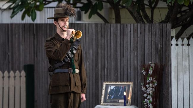 Lighting up the dawn Anzac Day Berrima Street Wynnum last year. Picture: Neale Maynard