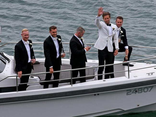 Ward and his groomsmen arrive by boat. Picture: Toby Zerna