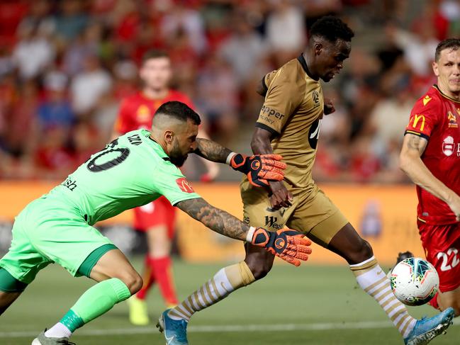 Mohamed Adam of the Wanderers beats Paul Izzo of United to score during the Round 12 A-League match between Adelaide United and the Western Sydney Wanderers at Coopers Stadium in Adelaide, Friday, December 27, 2019. (AAP Image/James Elsby) NO ARCHIVING, EDITORIAL USE ONLY