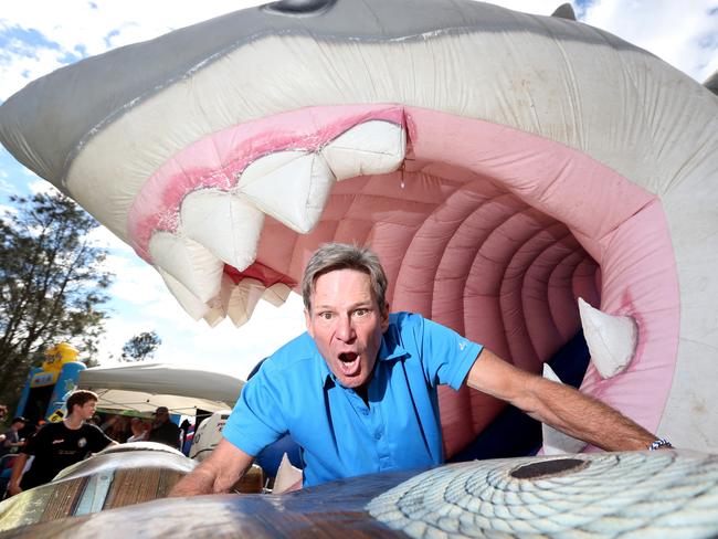 Footy Show presenter Sam Newman was in his element with an inflattable shark jumping castle. Picture: Tait Schmaal.