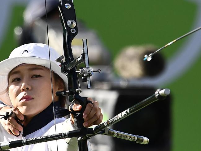 South Korea's Hyejin Chang shoots an arrow during the Rio 2016 Olympic Games women's quarterfinal match at the Sambodromo archery venue in Rio de Janeiro, Brazil on August 11, 2016. / AFP PHOTO / Jewel SAMAD