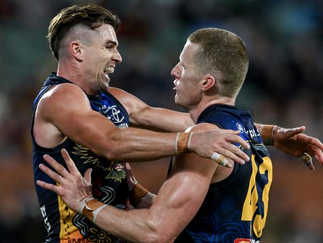 ADELAIDE, AUSTRALIA - MAY 26:   Reilly O'Brien of the Crows   celebrates a goal with   Ben Keays of the Crows during the round 11 AFL match between Kuwarna (the Adelaide Crows) and Waalitj Marawar (the West Coast Eagles) at Adelaide Oval, on May 26, 2024, in Adelaide, Australia. (Photo by Mark Brake/Getty Images)