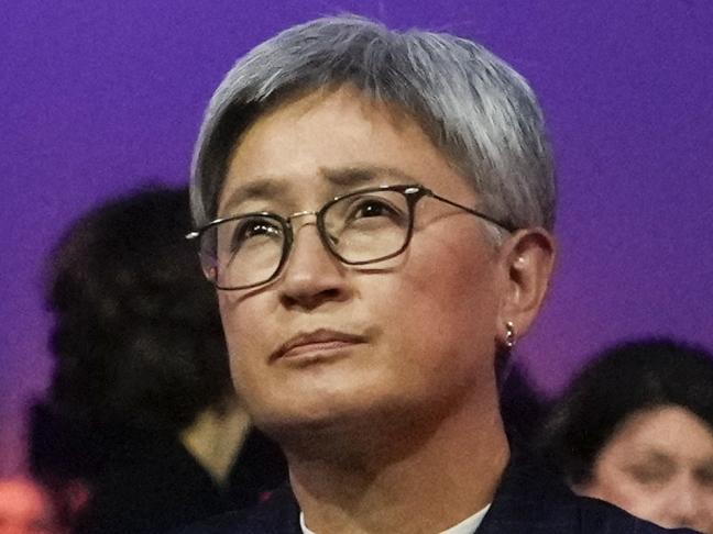 Australian Foreign Minister Penny Wong places lit candle candle at the Auschwitz-Birkenau former Nazi German concentration and extermination camp, during a ceremony marking the 80th anniversary of its liberation, in Oswiecim, Poland, Monday, Jan. 27. 2025. (AP Photo/Czarek Sokolowski)