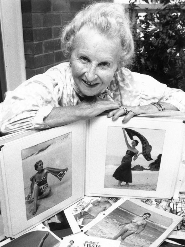 Paula Stafford with photographs of models wearing her designs.