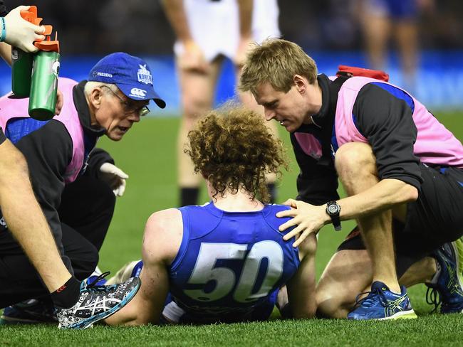 Brown, in the hands of trainers, was stretchered off and eventually taken to hospital. Picture: Getty Images