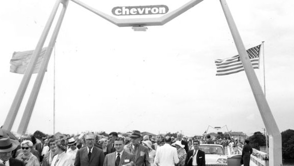 Guests and officials walking across the bridge for the opening ceremony of the bridge to Chevron Island, Surfers Paradise, Queensland, 12 March 1960. Ellis Hinds, photographer. Supplied by Gold Coast City Council Local Studies Library.