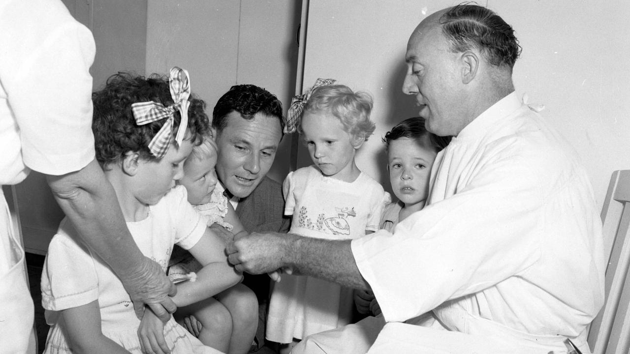 Doctor R.V. Graham giving anti-tetanus injections to children at City Hall. Picture: Bob Millar