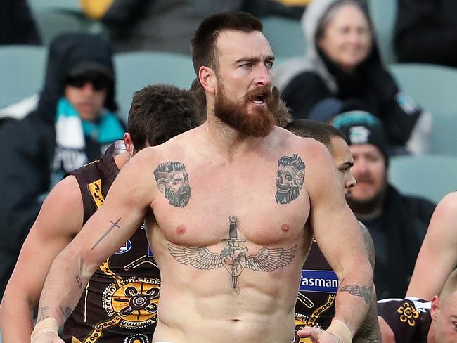 AFL - Saturday, 22nd August, 2020 - Port Adelaide v Hawthorn - Indigenous Round at the Adelaide Oval. Players from both teams try to separate Ports Charlie Dixon and Hawthorn's Liam Shiels Picture: Dixon loses his shirt Sarah Reed