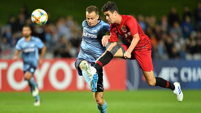 Sydney’s Alex Wilkinson denies Shanghai's Oscar an opportunity during their Asian Champions League match at Jubilee Stadium on Wednesday. Picture: AAP