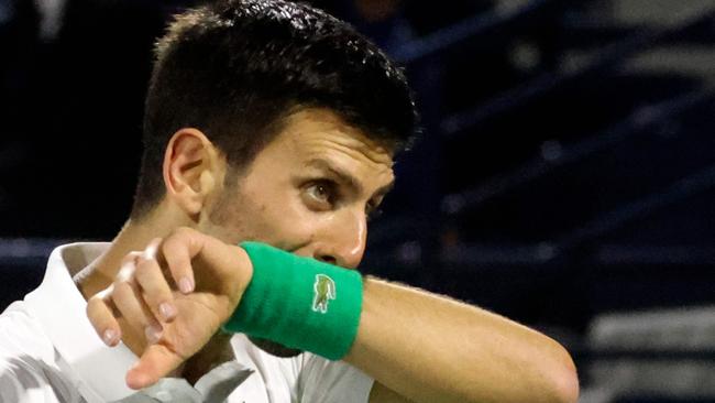 Serbia's Novak Djokovic reacts during his quarter-final match with Czech Republic's Jiri Vesely at the ATP Dubai Duty Free Tennis Championship, in the Gulf emirate on February 24, 2022. (Photo by Karim SAHIB / AFP)