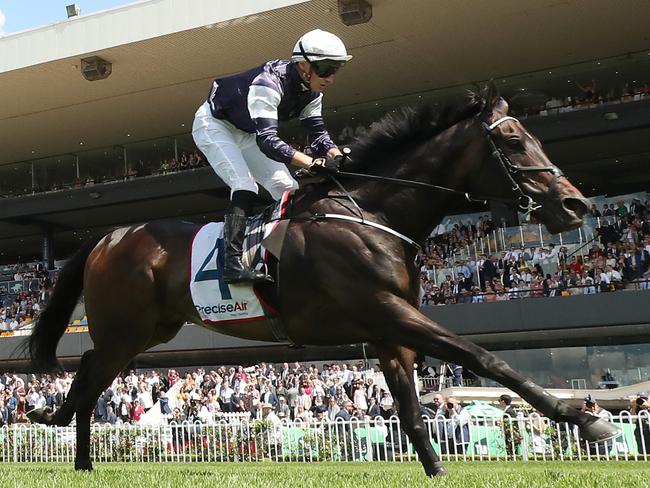 SYDNEY, AUSTRALIA - MARCH 23: Tom Marquand riding Post Impressionist wins Race 2 Precise Air N E Manion Cup during the Golden Slipper Day - Sydney Racing at Rosehill Gardens on March 23, 2024 in Sydney, Australia. (Photo by Jeremy Ng/Getty Images)