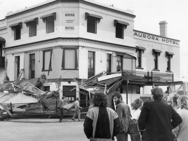 The Aurora in Hindmarsh Square, being demolished in 1983, as protesters watch.