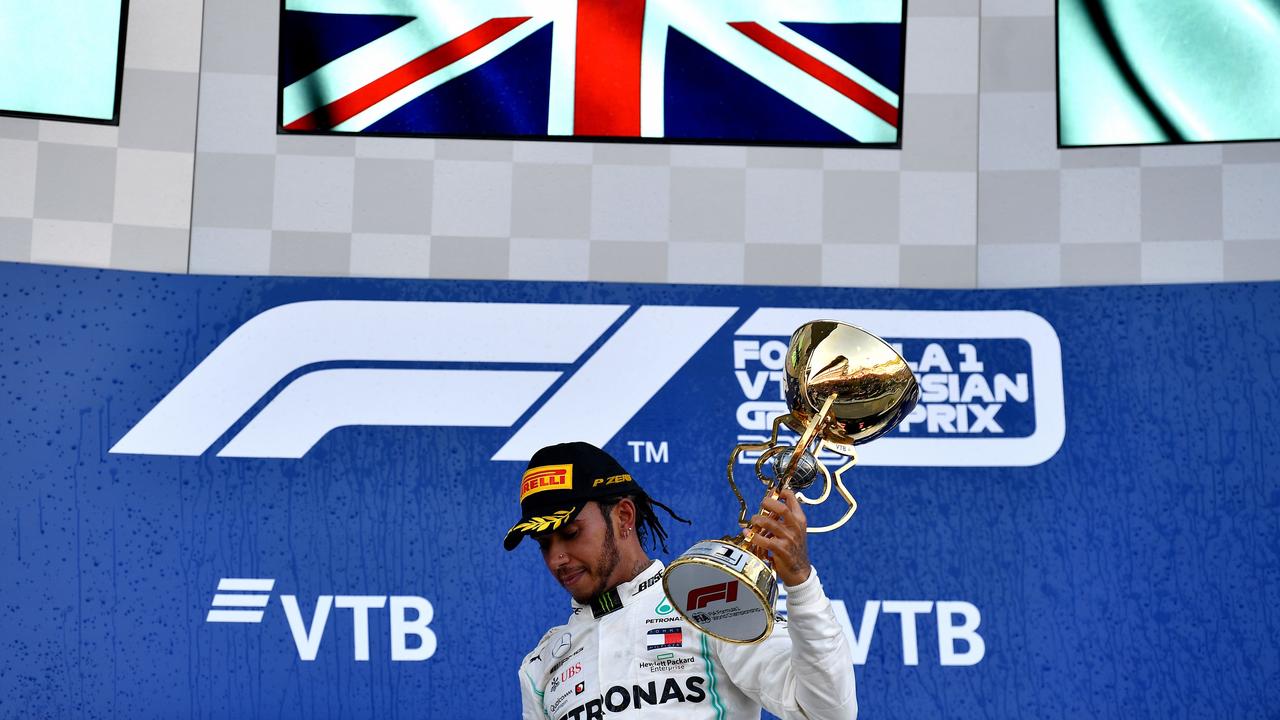 Winner Lewis Hamilton celebrates on the podium in Sochi. Picture: Dimitar Dilkoff