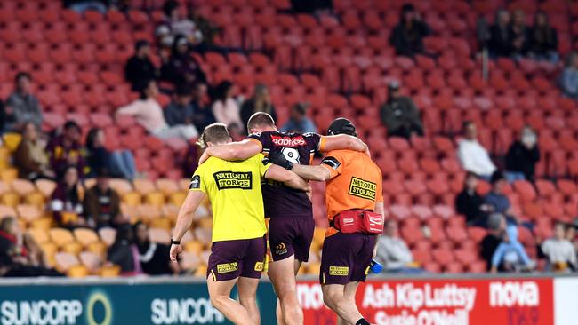 Matt Lodge has to be helped from the field in the Broncos loss to the Titans. Picture: AAP.